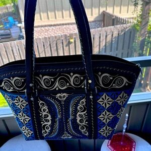 Banda tote bag originally $250. Used once.  It has a storage bag.